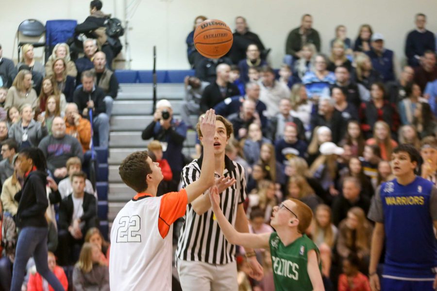 Referee Senior Dylan Claassen gets the game started with the jump ball.