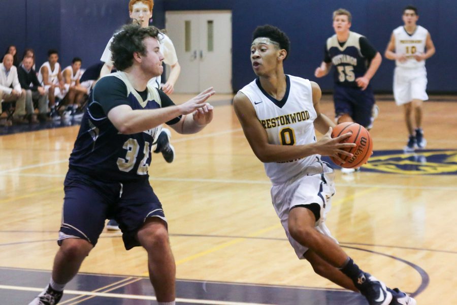 Sophomore Justin Webster drives for the basket against McKinney Christian. This is Justins second year as a starter on the Boys Varsity Basketball team.