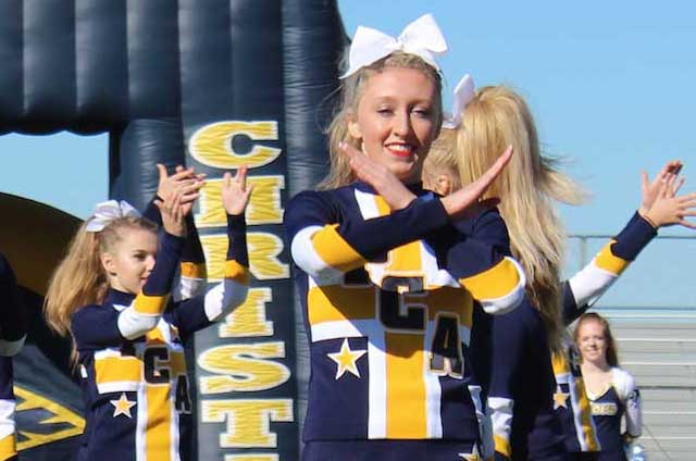 Senior Lauren Pangburn performs during the Homecoming Pep Rally with the Competitive Cheer team. Lauren began cheering when she was just 5.