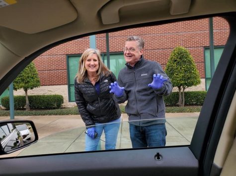 Lower School Principal, Mrs. Paige Deleon and Executive Director / Interim Head of School, Mr. John Klingstedt welcome Lower School families during curriculum pick-up. This late March event served to pass out materials to help families facilitate online learning at home during the pandemic.