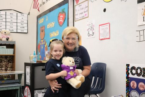 Kindergarten teacher Mrs. Jeanna Soper celebrates a virtual field trip to Build A Bear with her students.
