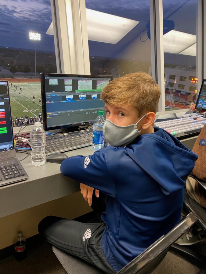 Dalton Chapin (10) runs the instant replay on the score board at the Homecoming football game!