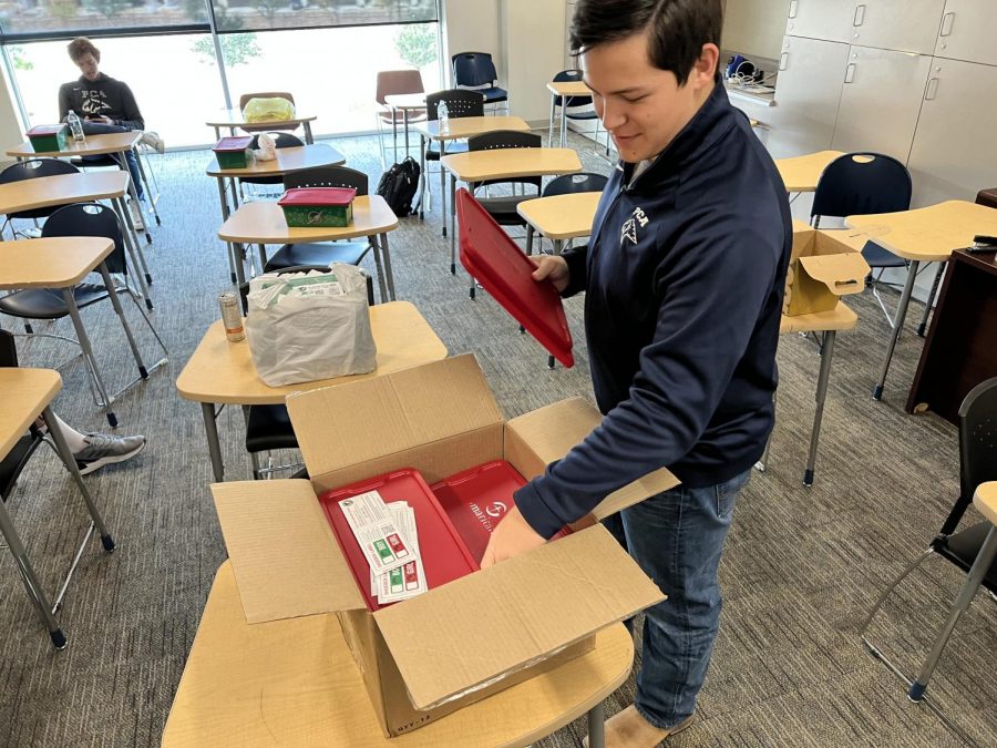 Senior Kade Kernal takes an Operation Christmas Child box to fill with toys, toiletries, and more