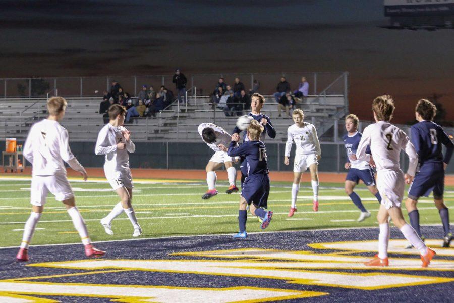 Senior Alex Song battles for a goal against Liberty Christian. The Lions defeated the Warriors, 1-0.