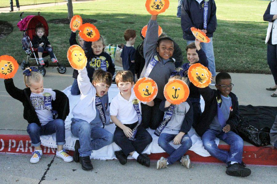 Students from Kindergarten teacher Julie Zarzycki's class at the North Campus wave lion shakers as the Parade passes by. 