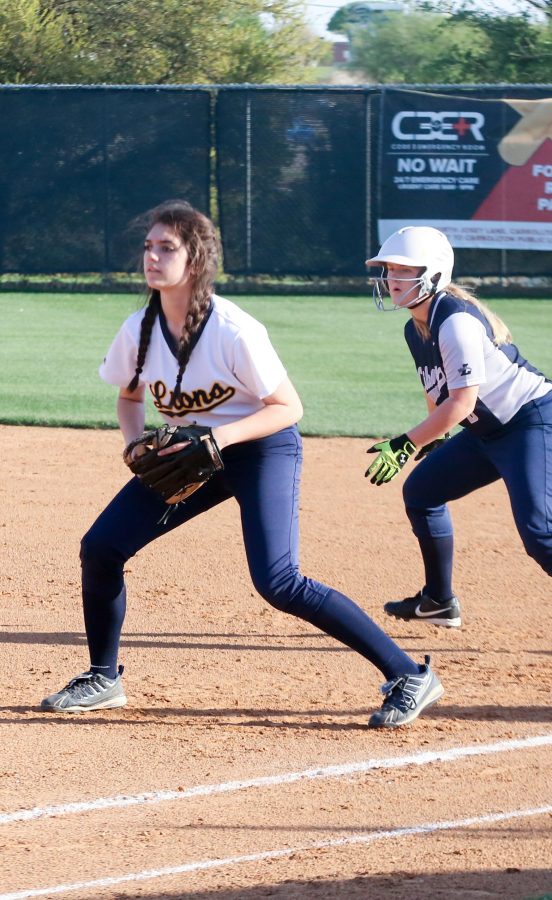 Junior Landry Strawbridge covers first base in the game against Liberty Christian. Landry is a three year Varsity starter for the Lions.