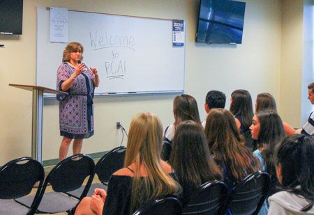 Upper School Principal Mrs. Wendy Morris welcomes new students during Back to School Day.