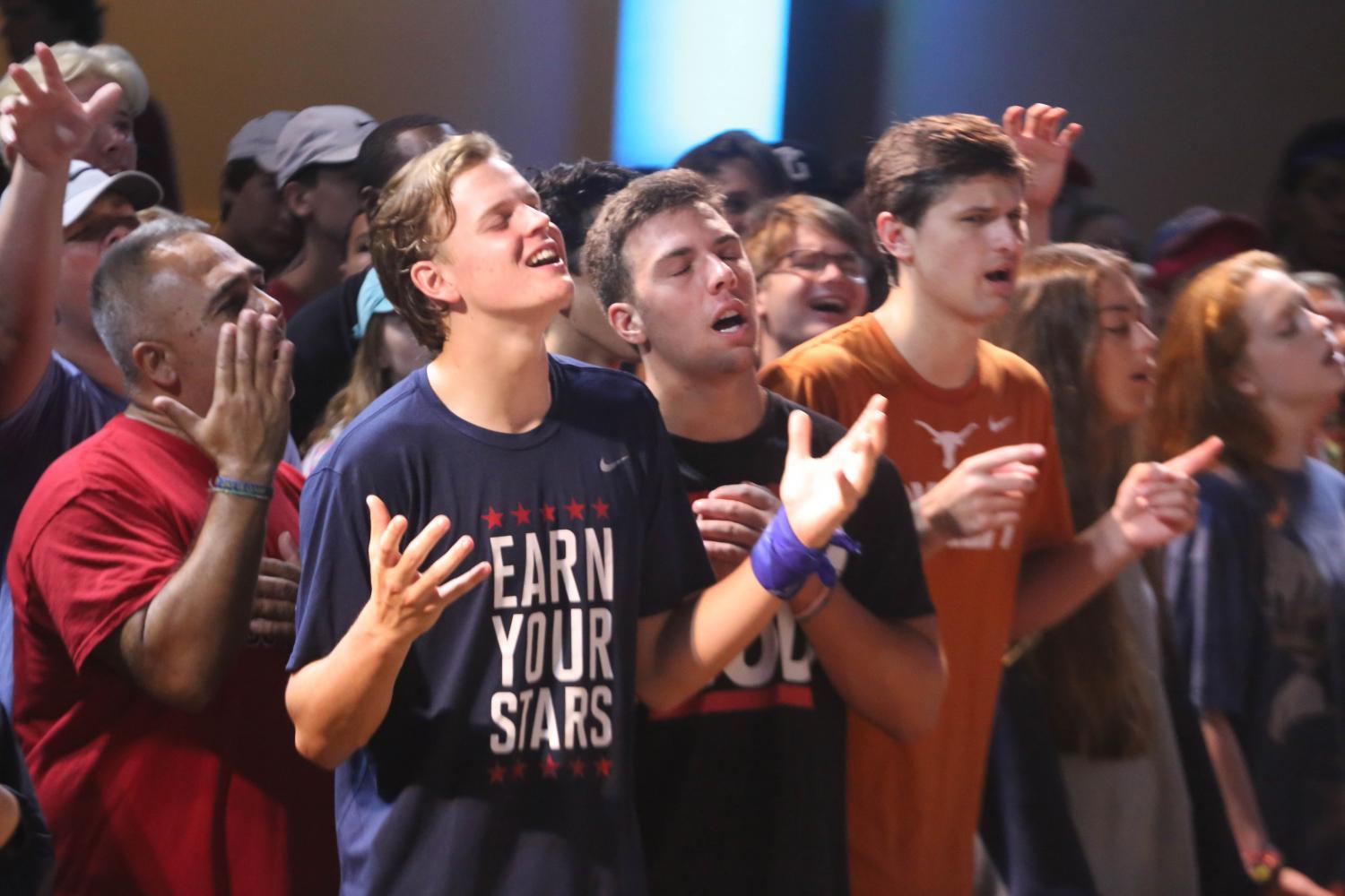 Spanish teacher Mr. Jody Garcia and Seniors Wiley Green, Sam Boese and Preston Panetti  worship with the JWood Band to focus their hearts and minds before Pastor Rob Wilton's message from Ephesians. He urged students to be ready before the battles come by utilizing the whole armor of God. 