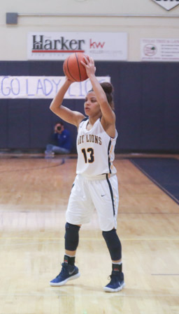 Junior Guard Payton Hicks looks for the pass in the game against Nolan.