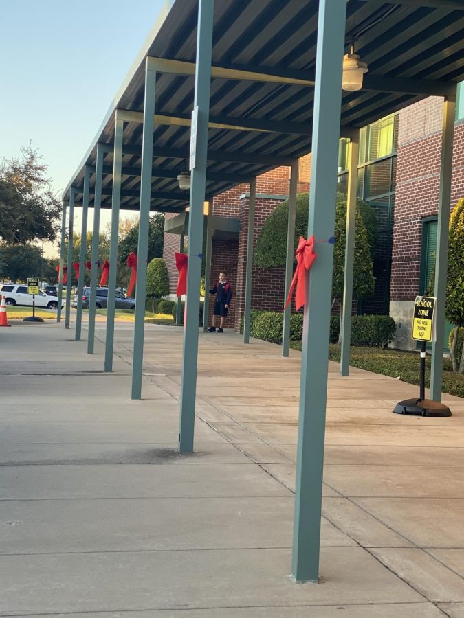 The Lower School celebrates Red Ribbon Week with decorating the outside of the school with red ribbons as parents drive-up through carpool.