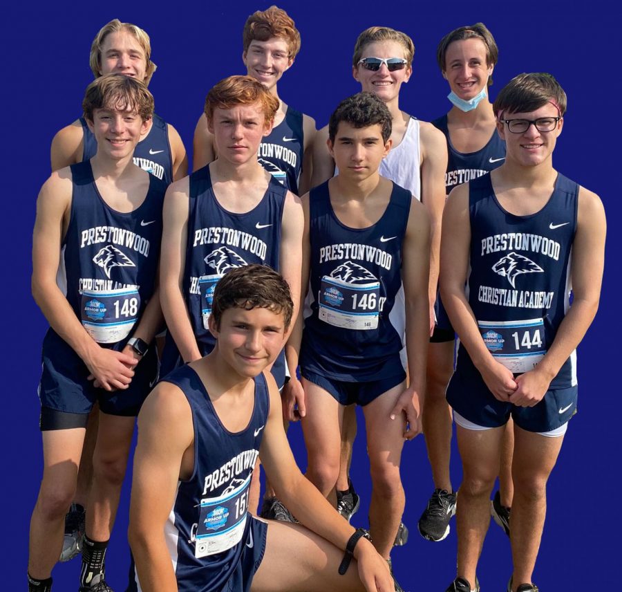 The Varsity Cross Country Team poses for a photo after a meet.