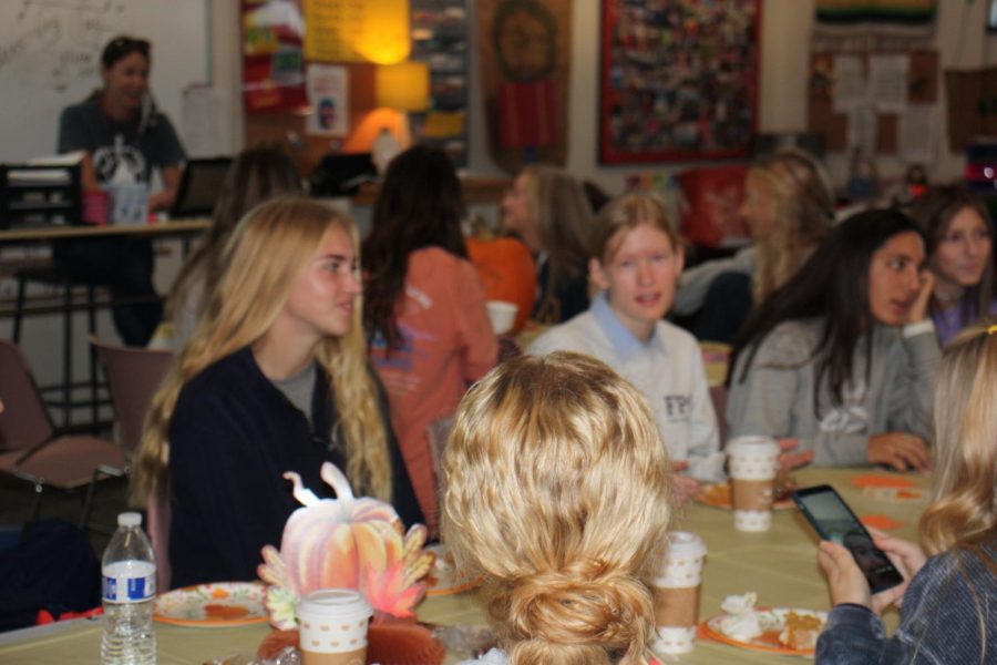 Sophomore Storie Sexton and Senior Courtney Brooks listen intently during Spanish teacher, Mrs. Wiehoff's chapel breakout session.