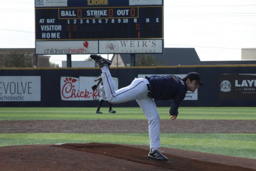 Arben Kolaj (11) begins the game by pitching for the Lions at PCA's Varsity Baseball game on February 25th, 2021.