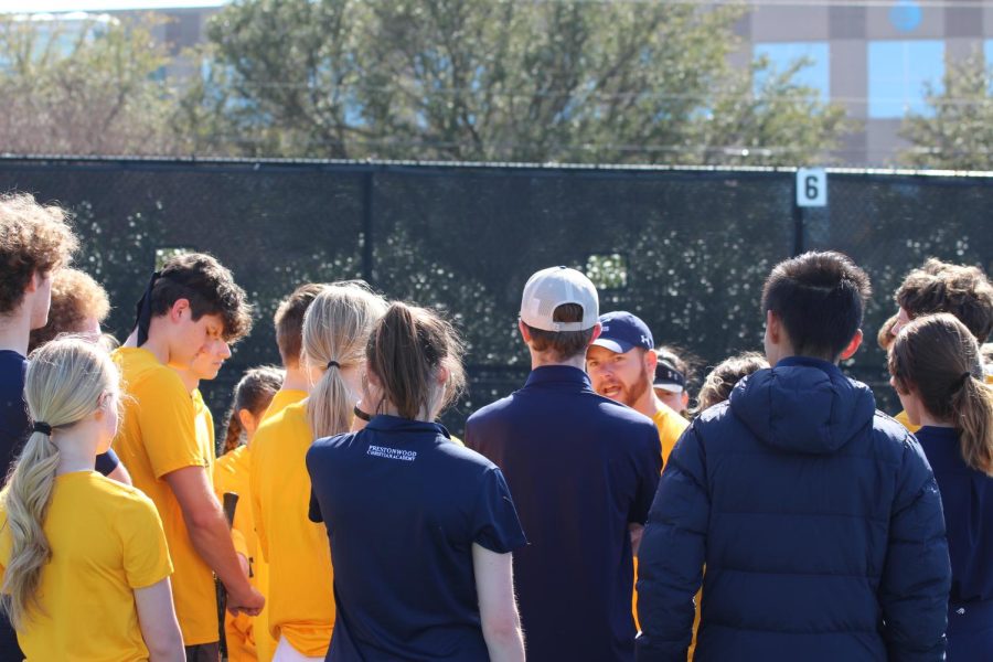 Coach Alex Baker gives a talk to players