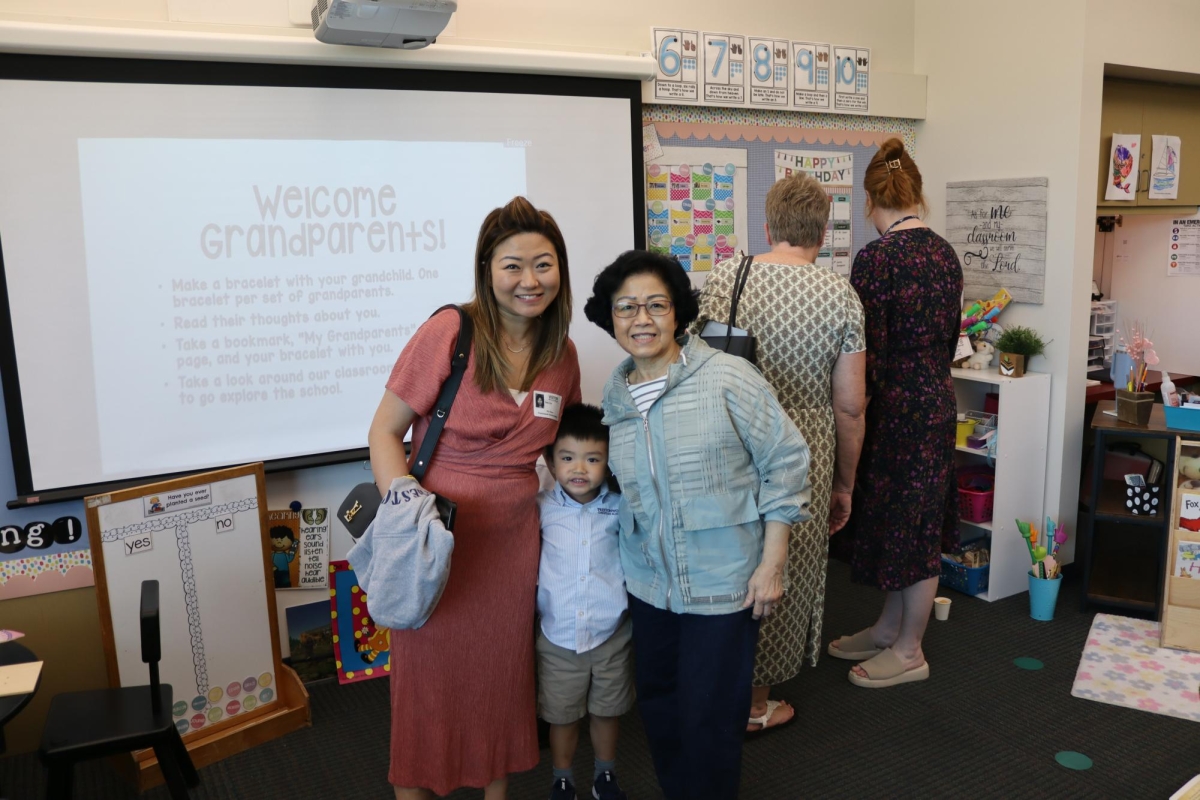 Family participating in Grandparent's day festivities. Photo by Trent Clarkson. 