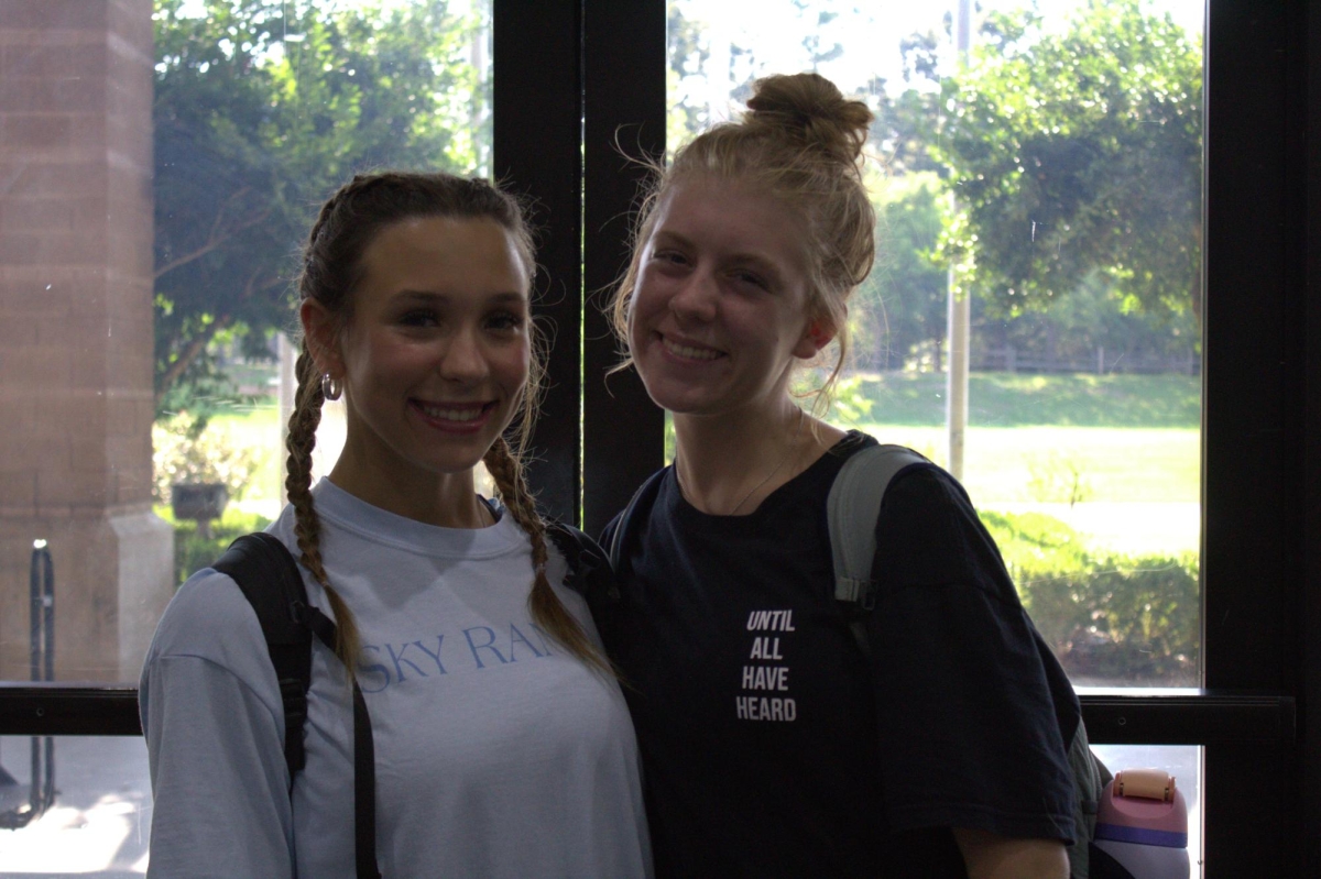Seniors Izzy Anderson (12) and Evie Bexley (12) bond at Sky Ranch after a worship session. Evie Bexley said, "It was a really fun trip and I enjoyed getting to spend time with my friends."