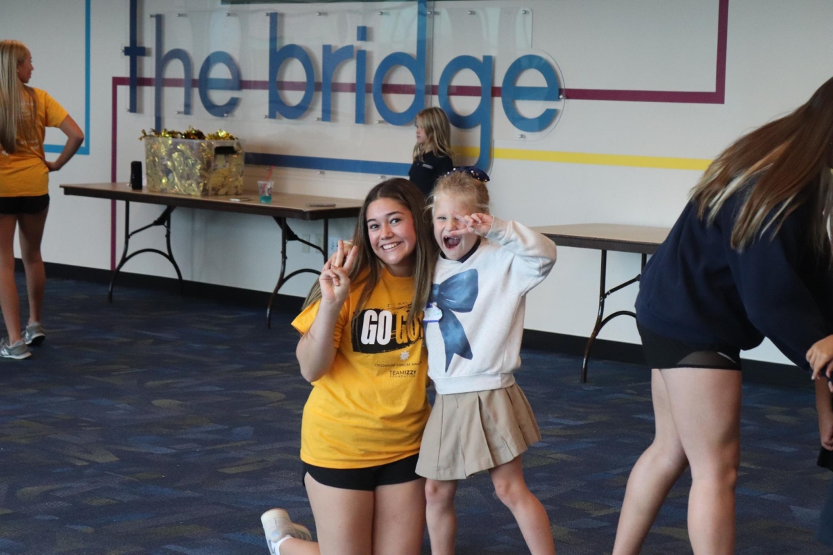 Lower School Girls Learn Alongside the Upper School Pom Team